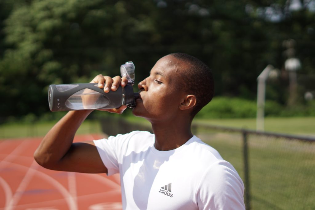 Man Drinking Water From a Water Bottle